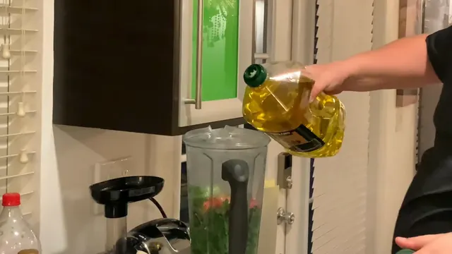 Olive oil poured into the blender