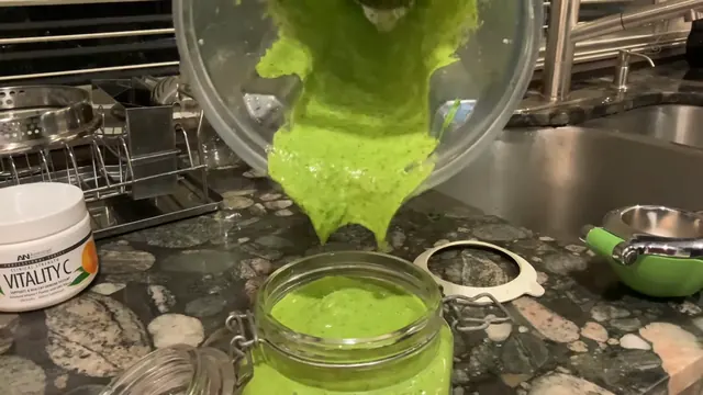 Chimichurri poured from the blender into a glass jar